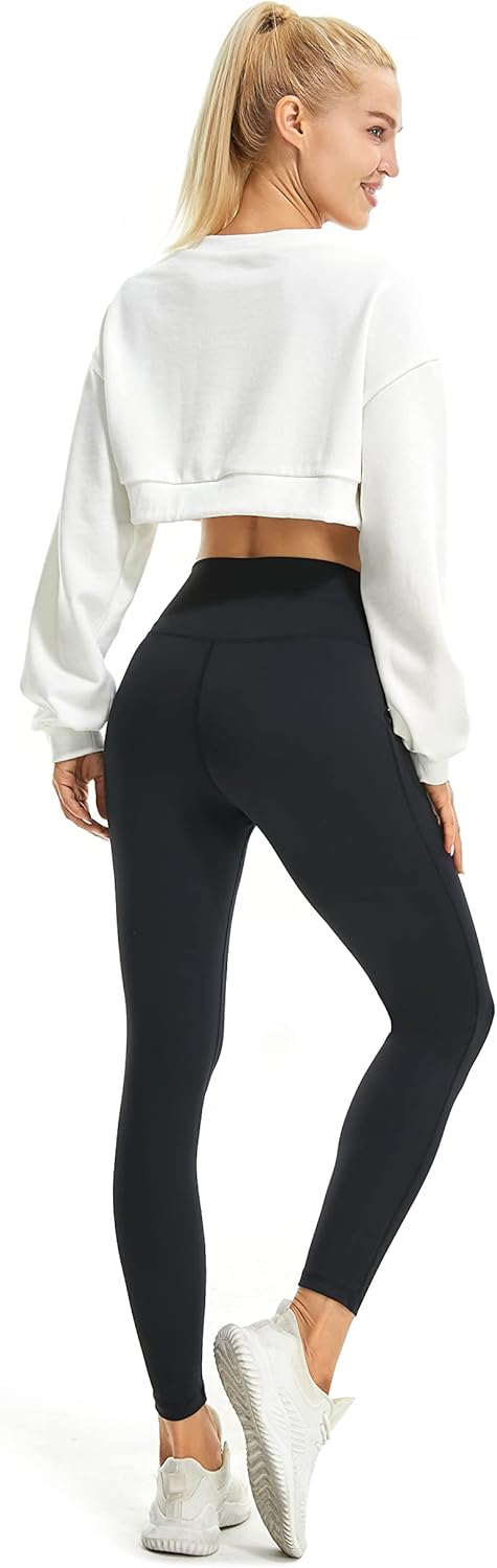 High-waisted flared yoga leggings in black with subtle bootcut opening from the knee