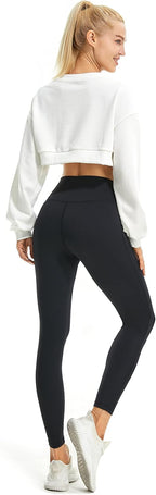 High-waisted flared yoga leggings in black with subtle bootcut opening from the knee