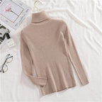 Beige ribbed knit turtleneck sweater with long sleeves and high collar