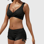 Black bikini set with cross-front bralette and ruched drawstring swim shorts
