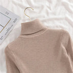Beige ribbed knit turtleneck collar and shoulder detail