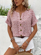 Pink floral short-sleeve button-up blouse with center button placket