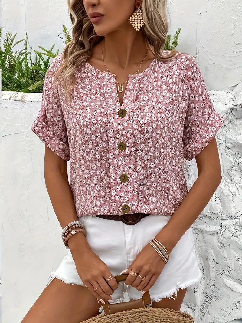 Pink floral short-sleeve button-up blouse with center button placket