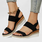 Black two-strap platform sandals with open toe and jute midsole