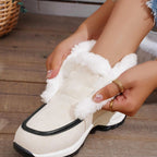 Women’s ankle platform boots in light cream fabric with white faux-fur trim and black sole.