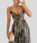 Floral maxi dress with ruffled straps, square neckline, green and burgundy floral pattern.