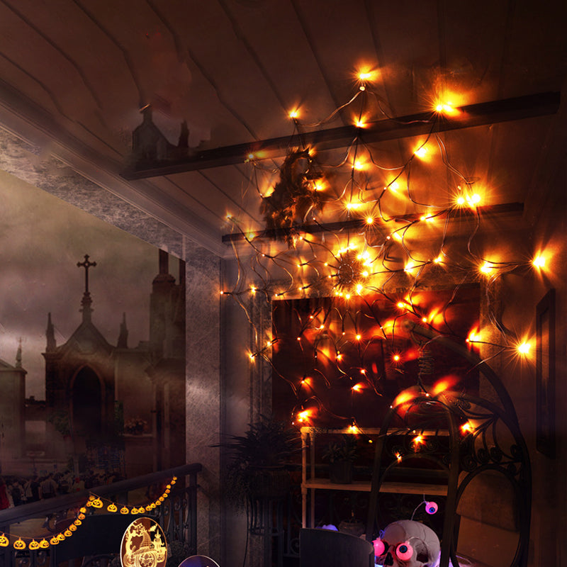 Warm LED spiderweb lights draped along ceiling beams with black spider accents