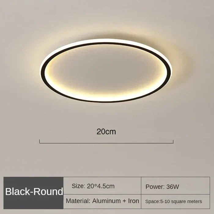 Black round LED flush mount ceiling light with warm glow, 20cm diameter