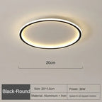 Black round LED flush mount ceiling light with warm glow, 20cm diameter