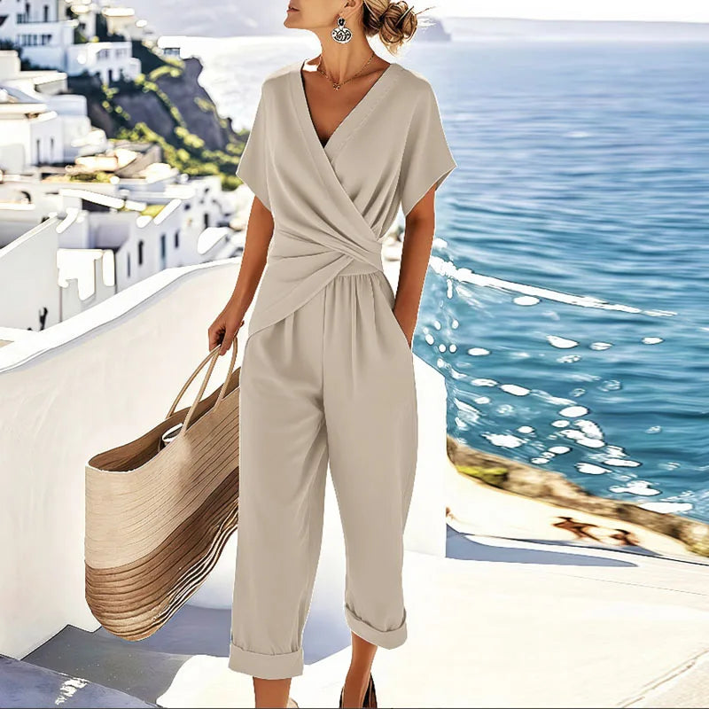 Women’s off-white V-neck jumpsuit with short sleeves, wrap front and tie waist, wide cropped legs