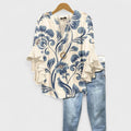 Women’s v-neck blouse with ruffle sleeves, cream base with blue swirl floral print