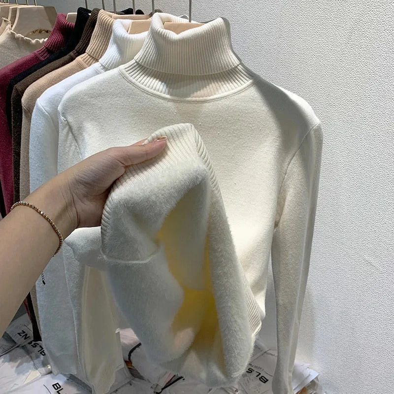 Cream white turtleneck velvet sweater with ribbed collar and fuzzy sleeve detail