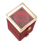 Red keepsake gift box with clear top window and red artificial rose centerpiece