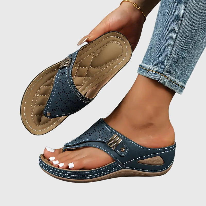 Women's wedge sandals in dark navy, perforated slide with buckle and tan strap detail