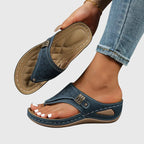 Women's wedge sandals in dark navy, perforated slide with buckle and tan strap detail