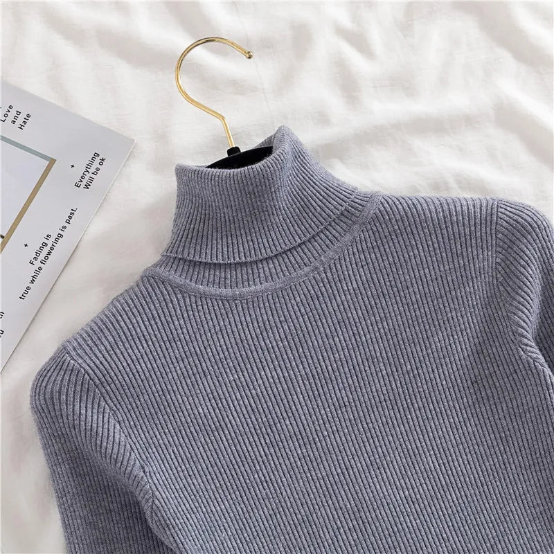 Ribbed turtleneck sweater in slate blue-gray, close-up of mock neck collar