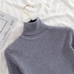 Ribbed turtleneck sweater in slate blue-gray, close-up of mock neck collar