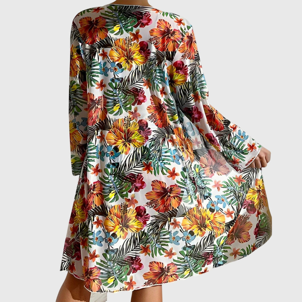 Floral beach cover-up over halter bikini top and high-waist bikini briefs