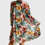 Floral beach cover-up over halter bikini top and high-waist bikini briefs