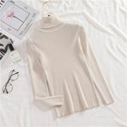 Ribbed turtleneck sweater in off-white/cream with long sleeves and mock neck
