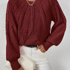 Women’s cable knit sweater with lantern sleeves, dark red, textured cable knit front.