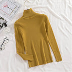 Ribbed turtleneck sweater in mustard yellow with long sleeves and mock neck