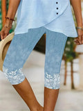Women's blue lace floral print leggings with lace detail at lower legs
