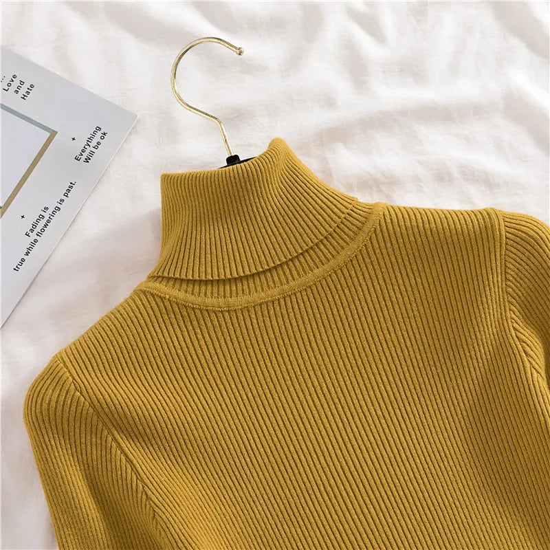 Ribbed turtleneck sweater in mustard yellow, close-up of mock neck collar