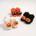 Children's Halloween cartoon slippers set in orange, black, and white with jack-o'-lantern faces