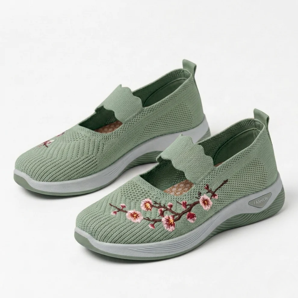 Green knit slip-on sneakers with floral embroidery and cushioned white sole