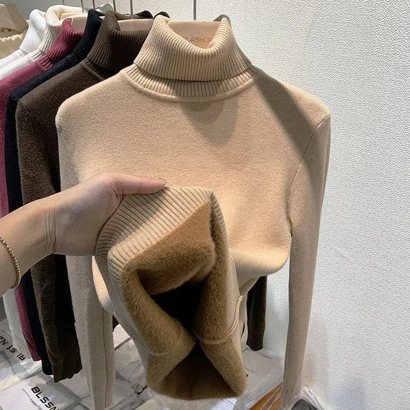 Beige turtleneck velvet sweater with ribbed collar and fuzzy sleeve cuffs