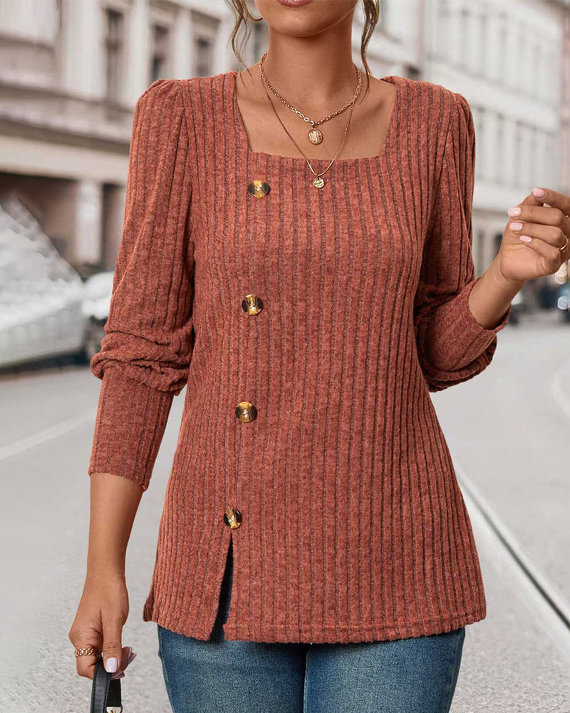 Rust orange ribbed knit tunic with square neckline, gold buttons, and rolled sleeves