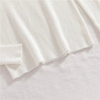 White ribbed knit turtleneck sweater sleeve cuff and straight hem