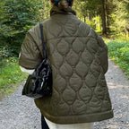 Olive quilted hooded jacket with circular pattern, back view