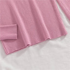 Pink ribbed knit turtleneck sweater hem and sleeve end detail