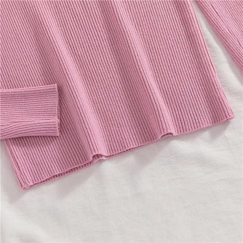 Pink ribbed knit turtleneck sweater hem and sleeve end detail