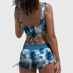 Blue tie-dye bikini set with lace-up cross-front bralette and drawstring swim shorts