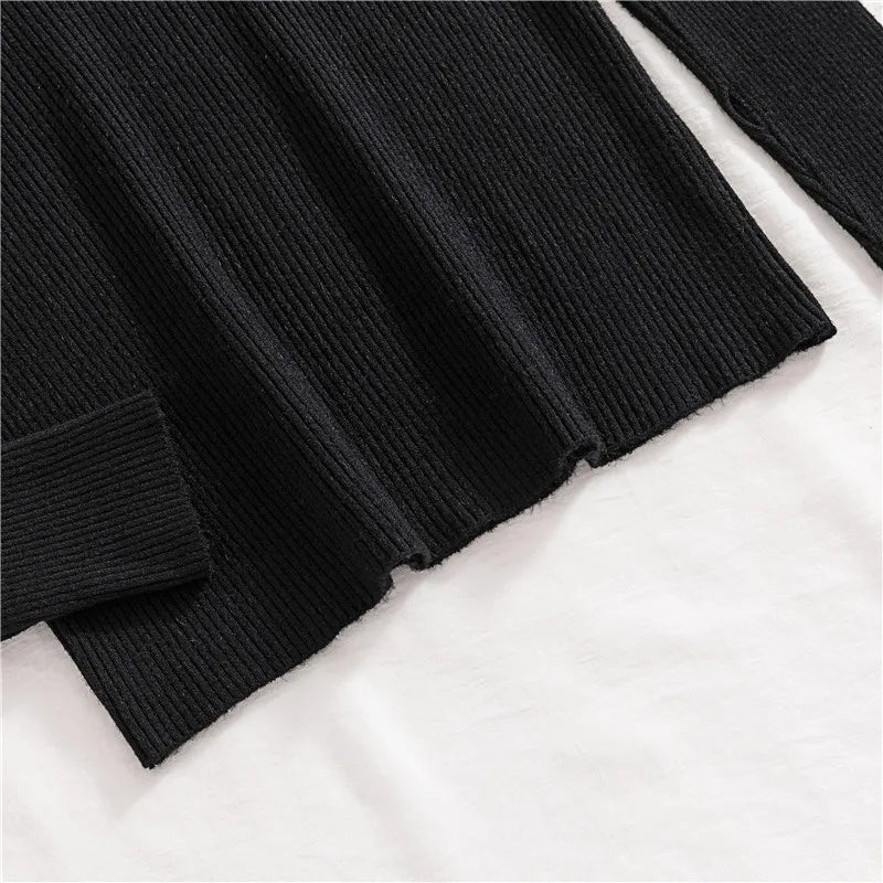 Black ribbed knit turtleneck sweater sleeve cuff and hem detail