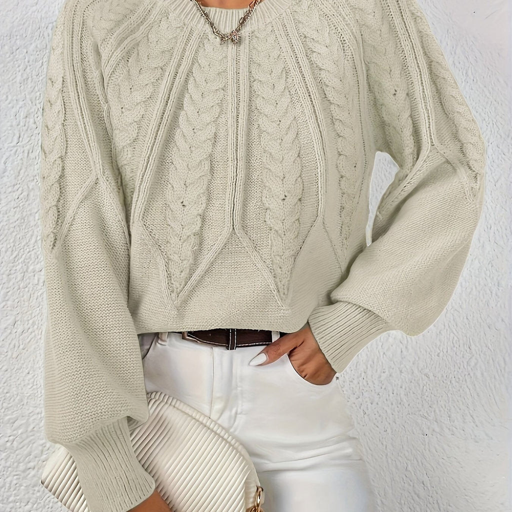 Women’s cable knit sweater with lantern sleeves, light brown, raised cable knit yoke.