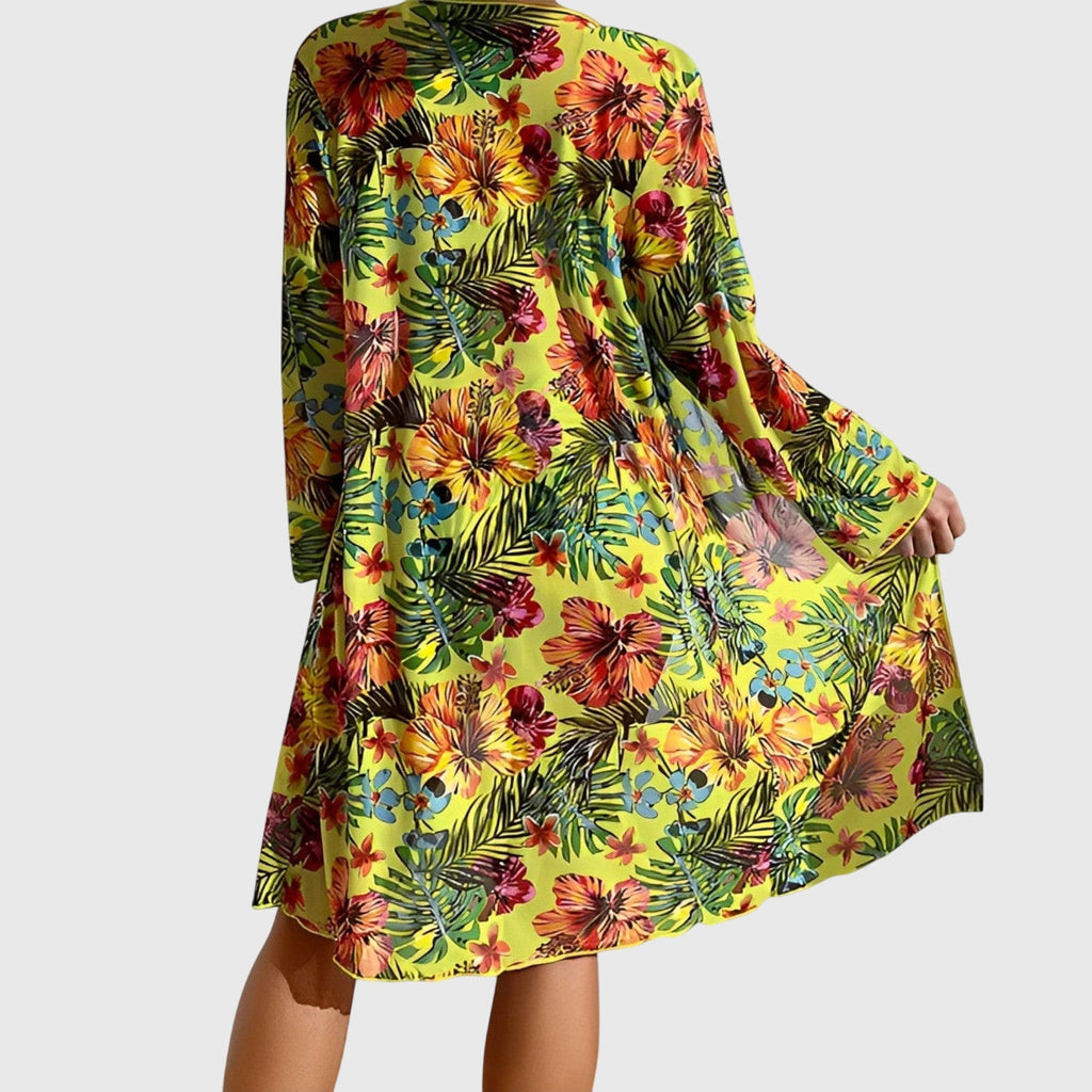 Multicolor floral cover-up over halter bikini top and high-waist bikini briefs