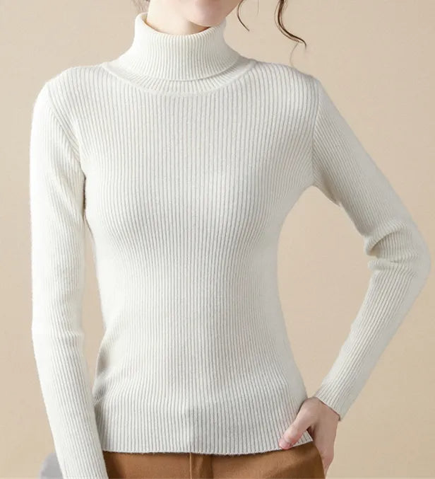 White ribbed turtleneck sweater with long sleeves and fitted knit silhouette.