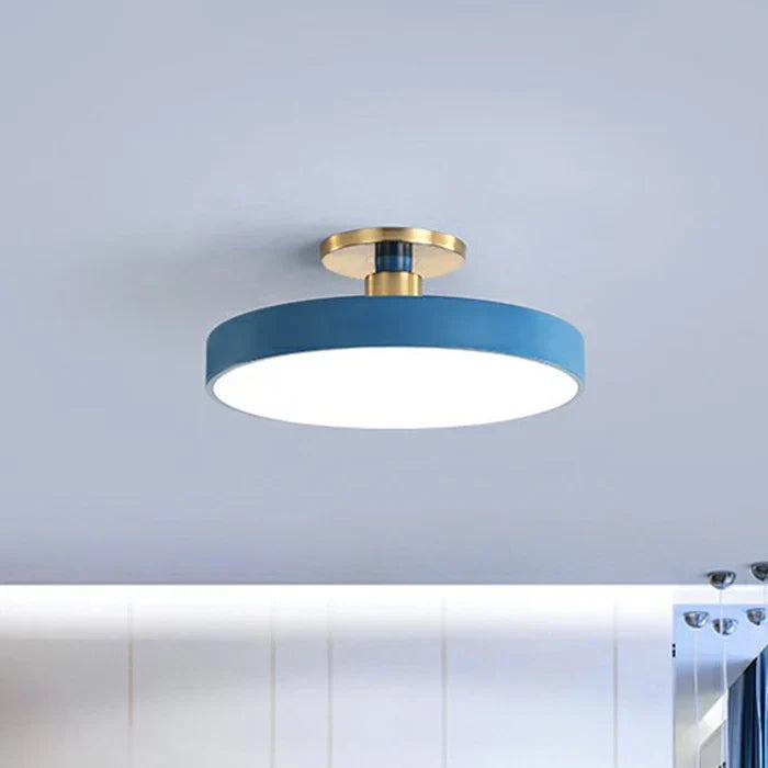 Round flush-mount LED ceiling lamp with blue shade and gold mounting ring