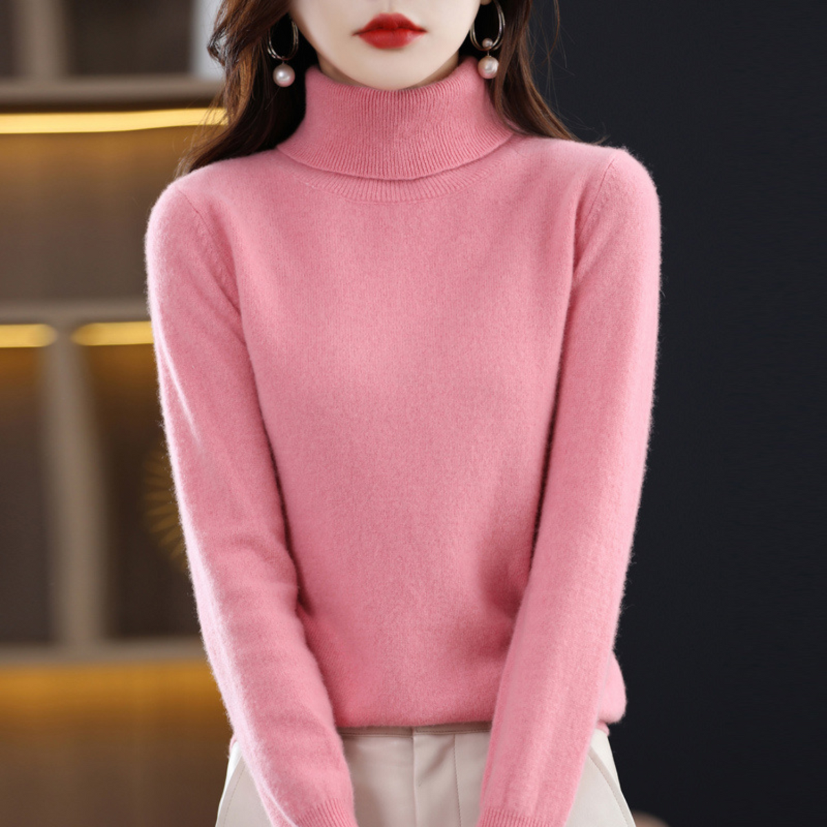 Cashmere turtleneck sweater with long sleeves, soft pink knit.
