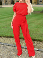 Red high-waist jumpsuit with short sleeves and tie waist sash, wide legs