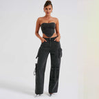 Black high-waist cargo jeans with relaxed fit and drawstring cord side pockets.