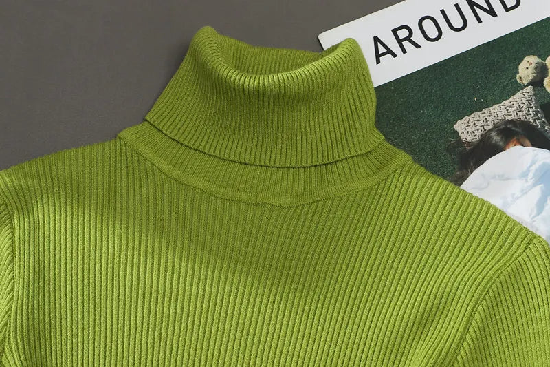 Lime green ribbed turtleneck sweater with a high collar and thick knit texture.