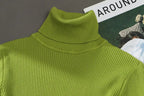 Lime green ribbed turtleneck sweater with a high collar and thick knit texture.