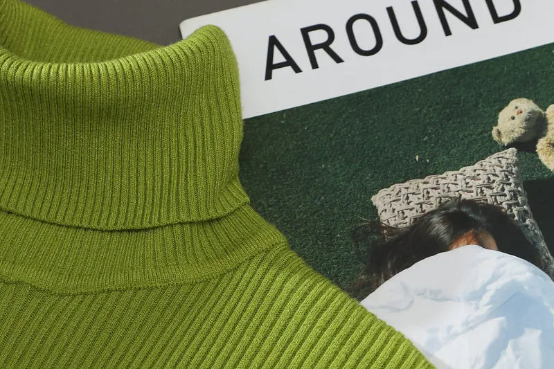 Lime green turtleneck collar close-up with ribbed knit and smooth seam lines.
