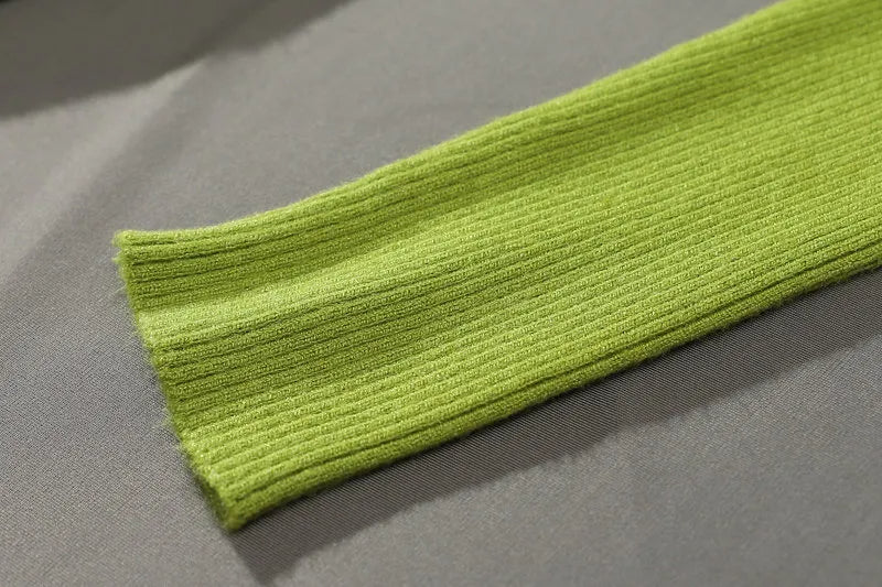 Lime green ribbed turtleneck sweater cuff and knit sleeve detail