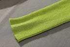 Lime green ribbed turtleneck sweater cuff and knit sleeve detail